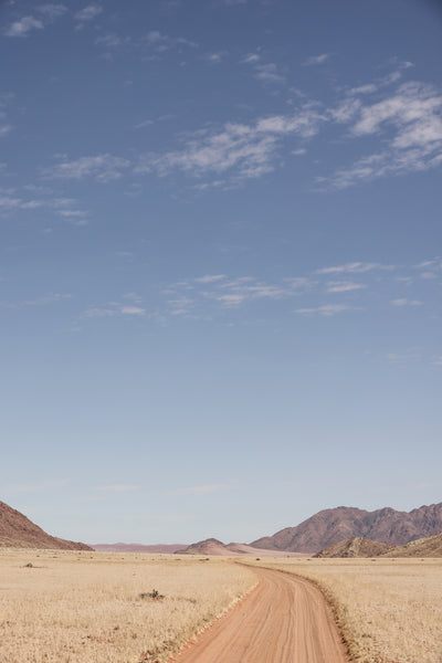 poster-print-vast-desert-road-under-a-clear-blue-sky