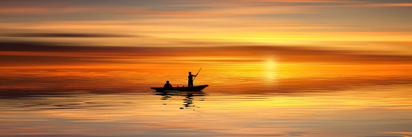 panoramic-canvas-print-boat-in-the-golden-light-panorama