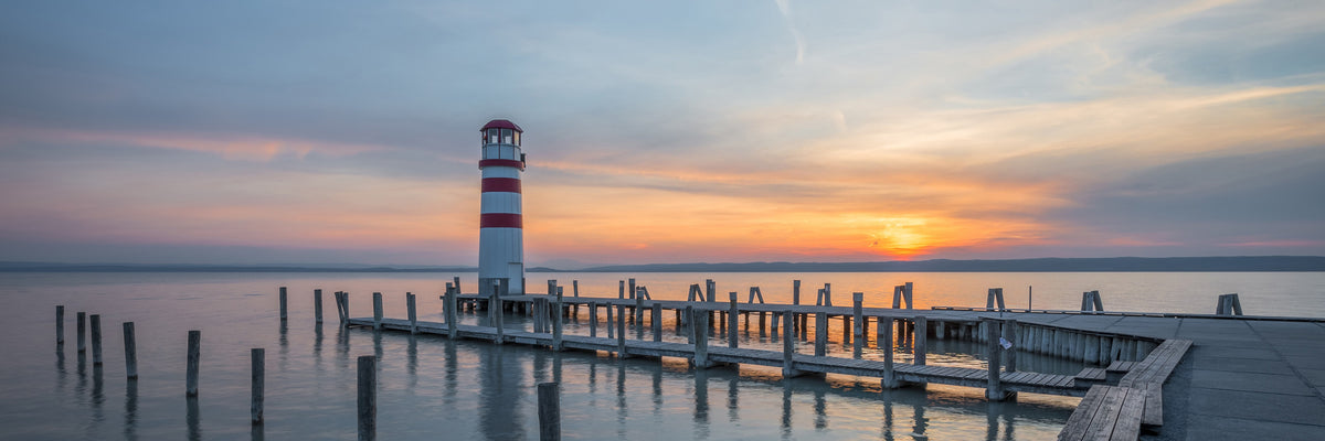 panoramic-canvas-print-lighthouse-in-the-sunset-panorama