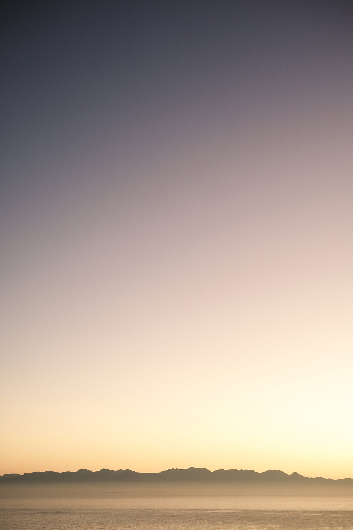 canvas-print-sunset-over-distant-mountains