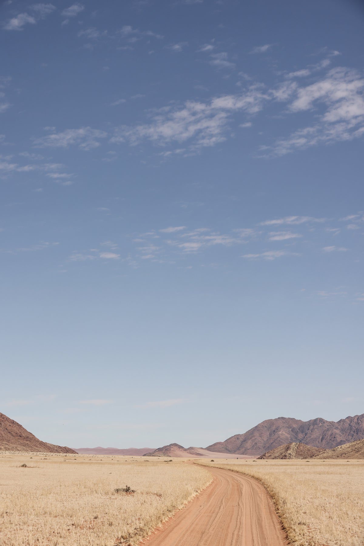 acrylic-print-vast-desert-road-under-a-clear-blue-sky