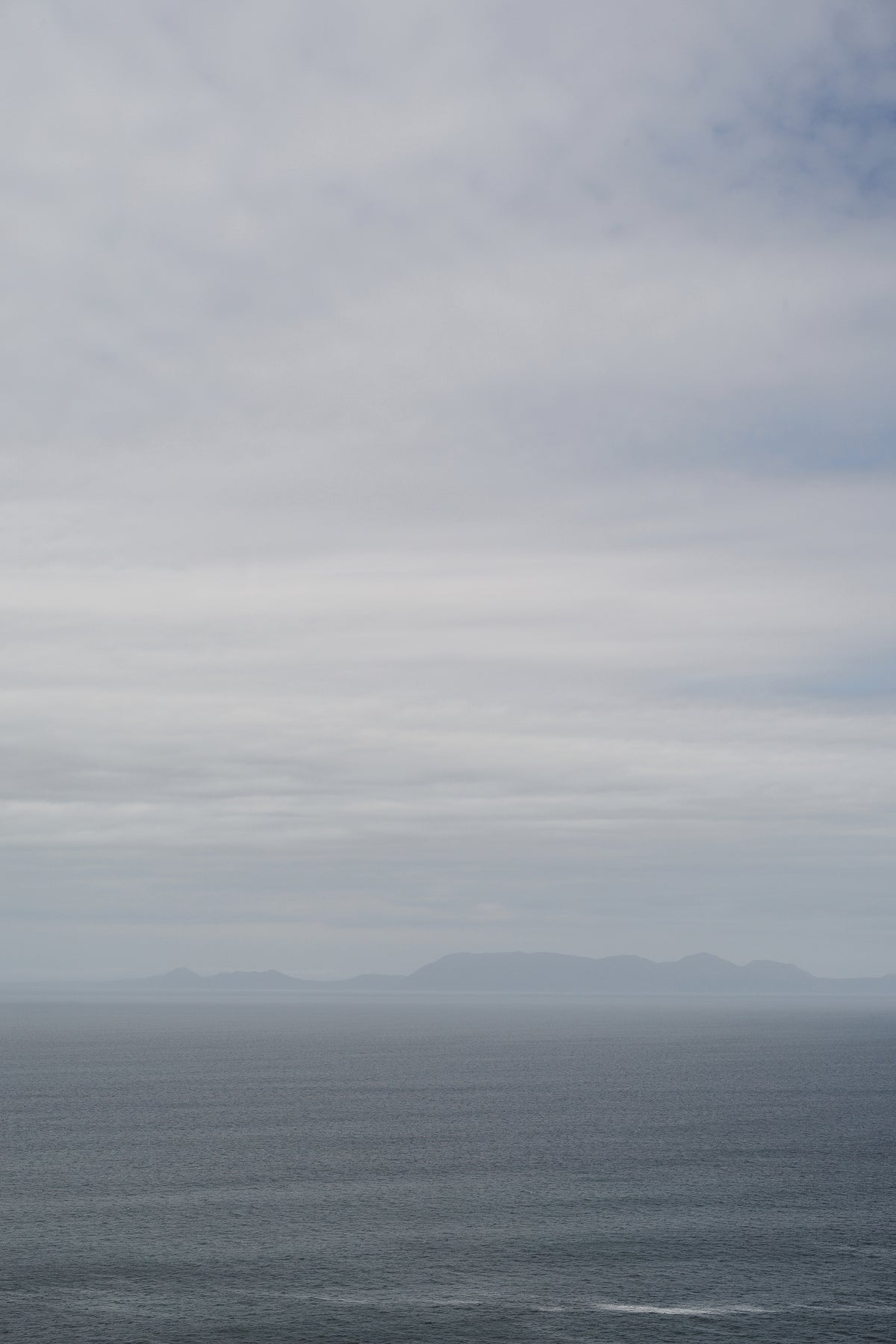 framedposter-print-tranquil-ocean-and-distant-horizon-under-a-clouded-sky