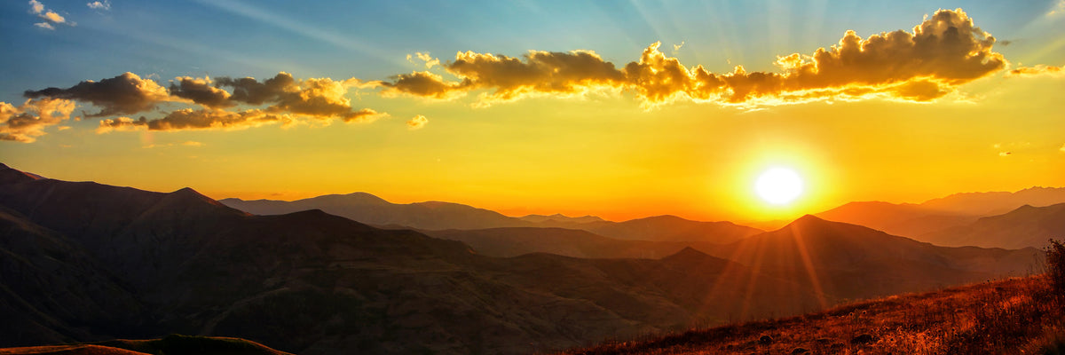 panoramic-canvas-print-sunset-in-the-world-of-mountains-panorama