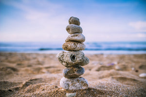 3-piece-acrylic-print-stone-pile-on-the-beach